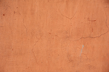 Texture of old wall covered with brown stucco