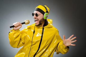 Man wearing yellow suit with mic