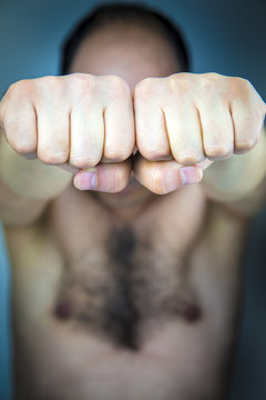 Adult man showing his fists