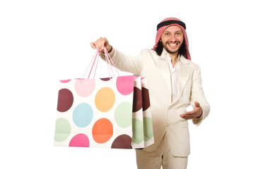 Arab man with shopping bags on white