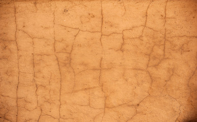 Texture of old wall covered with yellow stucco