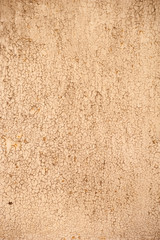 Texture of old wall covered with yellow stucco