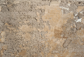 Texture of old wall covered with brown stucco