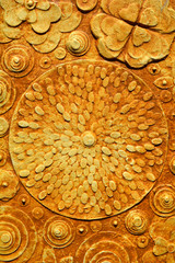 Grunge flowers, abstract background the color of dark wood or rich soil, rustic, made of clay pigment and raw umber, sienna, 3d, three dimensional grunge embossing and carving.