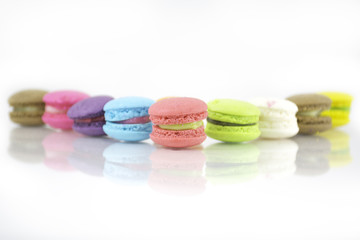 Obraz na płótnie Canvas French colorful macarons isolated on white with path
