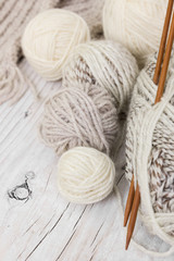 Fototapeta na wymiar Skeins of wool yarn and knitting needles from bamboo