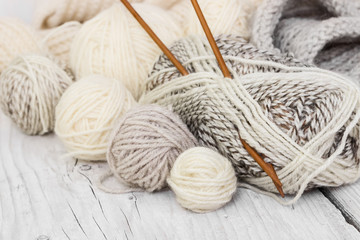 Fototapeta na wymiar Skeins of wool yarn and knitting needles