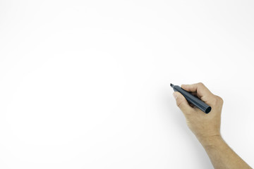 Hand holding a black marker isolated on white with copy space
