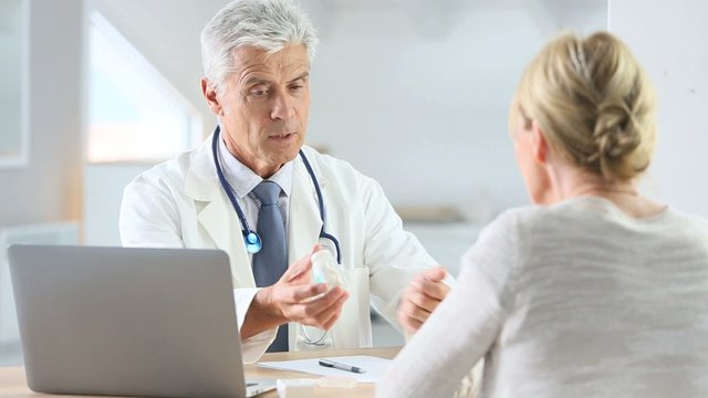 Doctor having consultation with patient in office