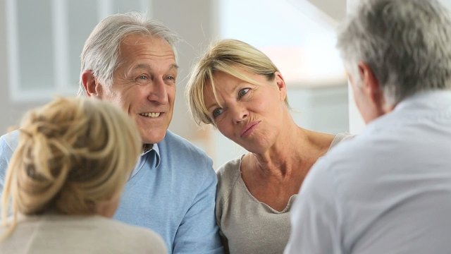 Couple attending group therapy