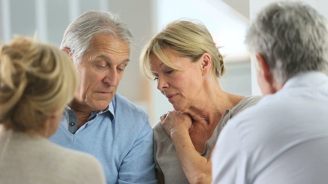 Couple attending group therapy