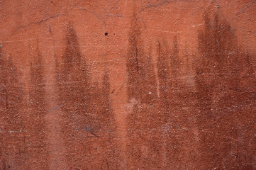 Texture of old wall covered with brown stucco