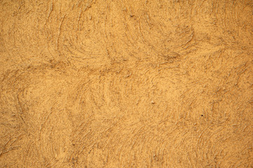 Texture of old wall covered with yellow stucco