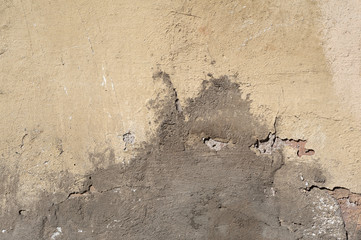 Texture of old wall covered with gray stucco