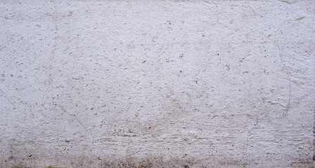 Texture of old wall covered with gray stucco