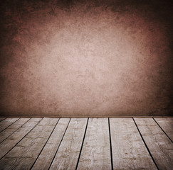 Grunge wall and wood paneled floor, interior of a room.