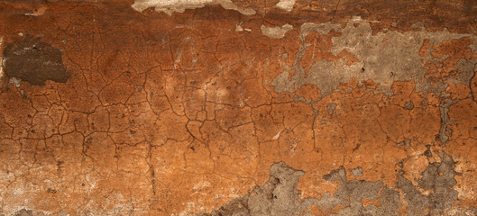 Texture of old wall covered with yellow stucco