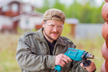 Obraz premium Worker with a drill