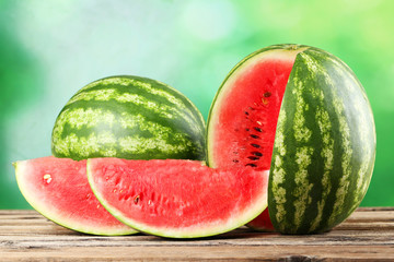 Tasty watermelon on brown wooden background