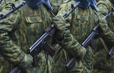 Soldiers in camouflage military uniform on rest position