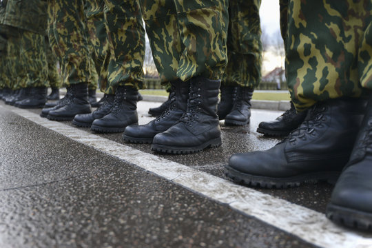 Soldiers in camouflage military uniform on rest position