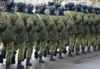 Soldiers in camouflage military uniform on rest position