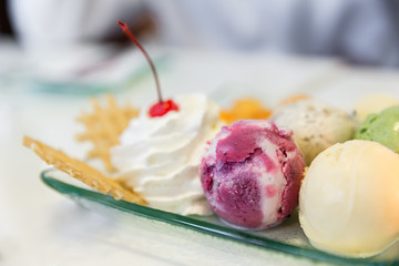 Assorted flavors of ice cream with various toppings