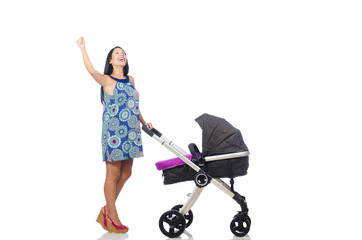 Happy mom with her baby in pram 