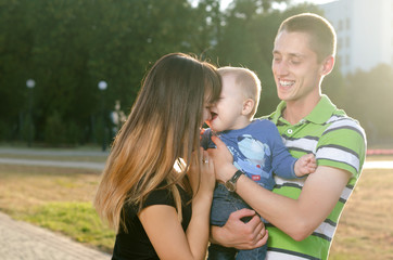 Fototapeta premium young family with a baby