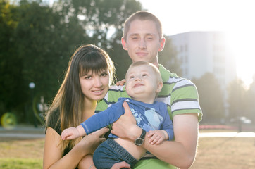 Fototapeta premium young family with a baby