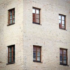 old grunge brick wall with six windows