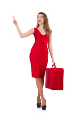 Young woman in red dress with suitcase isolated on white