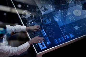 businessman hand working with modern technology and digital laye