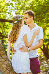 Fototapeta premium happy young couple enjoying vacation at city park. Warm toned
