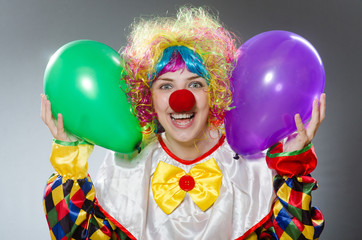 Clown with balloons in funny concept