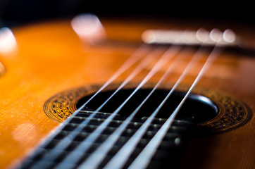 Close up of a guitar rosette on the armonic upper table from an angle with out of focus area bokeh 
