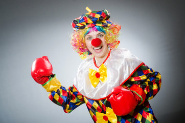 Funny clown in comical concept