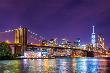 Beautiful  New York City view of the Brooklyn Bridge looking towards Manhattan at night