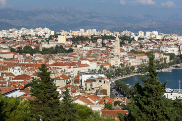 Fototapeta na wymiar View of Split's waterfront, historic old town and beyond from above in Croatia.