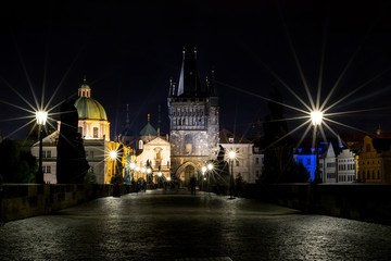 The Charles Bridge in the evening, in the light of lanterns. 
