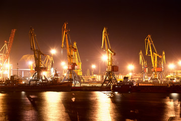 Fototapeta premium industrial port with cranes at night