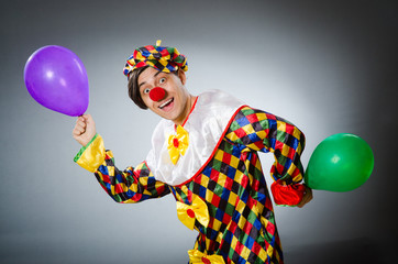 Funny clown in comical concept