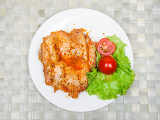 Chicken fillet in spicy sauce with vegetables