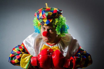 Funny clown in comical concept