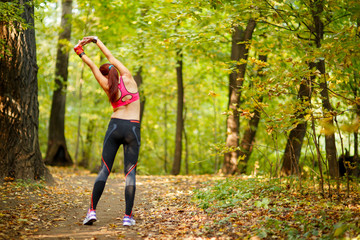 woman runner stretching before her workout