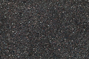 Black asphalt pavement closeup background texture