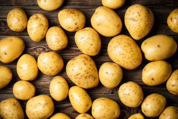 potatoes on wooden background