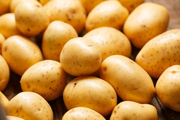 potatoes on wooden background