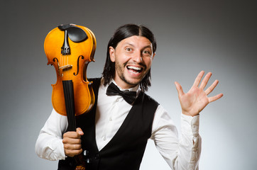 Man playing violin in musical concept