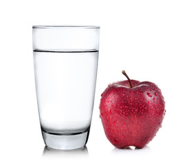 Glass of water and apple isolated on white background
